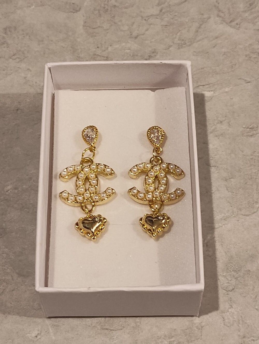 Chanel earrings ft. a faux pearl CC logo, teardrop Crystal Post, & Heart Charm
